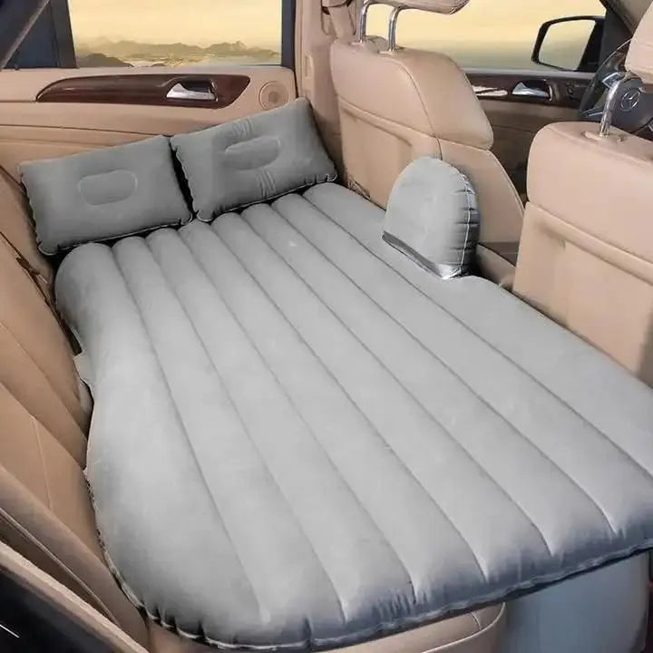 Portable car air mattress in gray, designed for comfortable sleeping in vehicles with two pillows