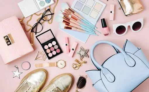 Stylish makeup kits with fast shipping including brushes, palettes, and accessories arranged on a pink background