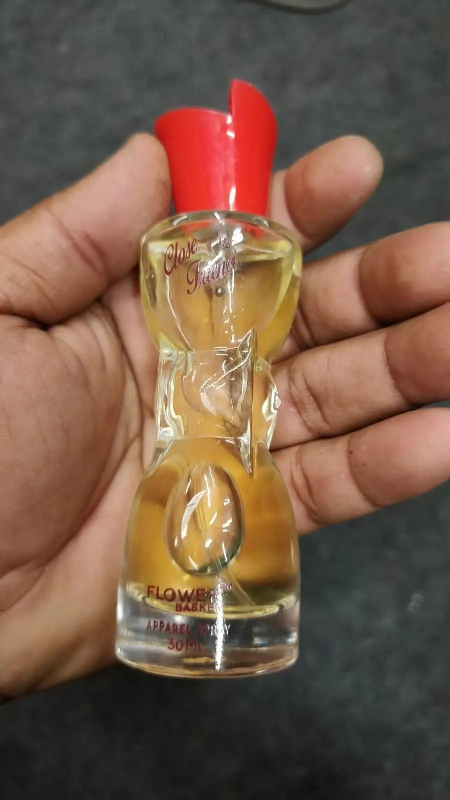 Chic floral bottle design of Long-lasting Scent Perfume held in hand, perfect for everyday use