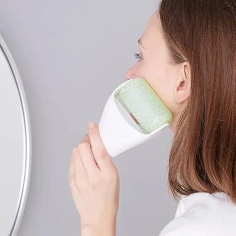 Woman using a reduce puffiness ice roller on her face for a refreshing skincare routine